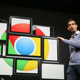 Sundar Pichai, Alphabet's CEO, stands in front of several screens displaying the Chrome logo.